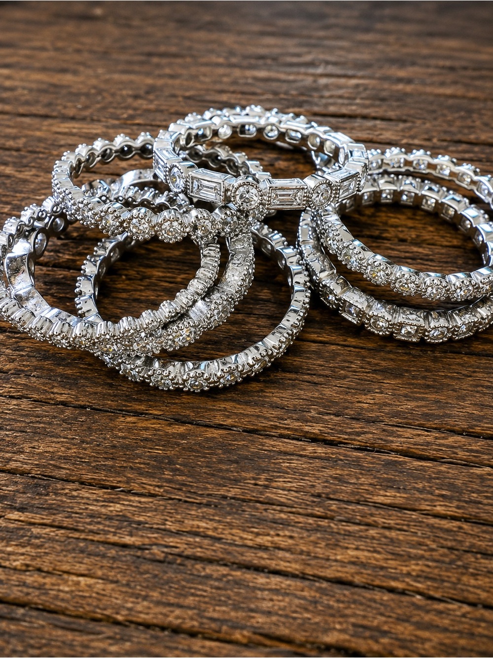 8 Sterling Silver and WG CZ Stackable Eternity Rings, size 6-7